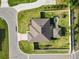 Aerial view showcases the home's roof, surrounding landscaping, well-maintained lawn, fenced backyard, and neighborhood at 3425 Sutton Ridge St, Lakeland, FL 33810