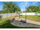 Backyard features brick fire pit and basketball court at 3425 Sutton Ridge St, Lakeland, FL 33810