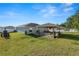 Large fenced backyard with outdoor patio and dining area at 3425 Sutton Ridge St, Lakeland, FL 33810