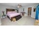 Inviting bedroom featuring a stylish bed with decorative pillows, ample natural light, and a cozy atmosphere at 3425 Sutton Ridge St, Lakeland, FL 33810