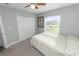 Bedroom with carpet flooring, a ceiling fan, window views, and ample natural light at 3425 Sutton Ridge St, Lakeland, FL 33810