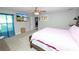 Cozy bedroom with a comfortable bed, a mounted TV, and soft lighting for a peaceful retreat at 3425 Sutton Ridge St, Lakeland, FL 33810