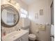 A quaint bathroom features an decorative mirror, vanity, medicine cabinet and shower at 3570 Milano Ave # 3570, Lakeland, FL 33803