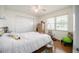 Bright bedroom features hardwood floors, a ceiling fan, and large closet space for ample storage at 3570 Milano Ave # 3570, Lakeland, FL 33803