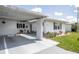 Cozy carport with ample space and elegant white columns leading to the front door at 3570 Milano Ave # 3570, Lakeland, FL 33803
