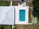 Aerial view of community pool, shuffleboard courts and recreation area with ample lounge seating at 3570 Milano Ave # 3570, Lakeland, FL 33803