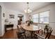 Bright dining room with hardwood floors, chandelier lighting, and large windows offering plenty of natural light at 3570 Milano Ave # 3570, Lakeland, FL 33803