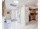 Bright foyer with tile flooring leading to an open kitchen and living area, welcoming guests at 3570 Milano Ave # 3570, Lakeland, FL 33803