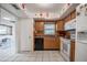 Functional kitchen featuring oak cabinets, black appliances, tile floors, and colorful decorative accents at 3570 Milano Ave # 3570, Lakeland, FL 33803