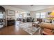 Spacious open-concept living room with fireplace, hardwood floors, and ample seating at 3570 Milano Ave # 3570, Lakeland, FL 33803