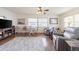 Bright living room area with hardwood floors, ceiling fan, and comfortable seating at 3570 Milano Ave # 3570, Lakeland, FL 33803