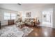 Bright living room with hardwood floors, a large window, and neutral décor at 3570 Milano Ave # 3570, Lakeland, FL 33803