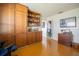 The office has wood floors, wood cabinets, a decorative door and small cabinet at 3570 Milano Ave # 3570, Lakeland, FL 33803