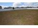 Spacious backyard enclosed by a tall white fence, offering privacy and plenty of room at 3882 Resting Robin Ave, Bartow, FL 33830