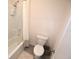 Neat bathroom featuring a bathtub with a shower, white toilet, and ceramic tile floors at 3882 Resting Robin Ave, Bartow, FL 33830
