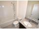 Modern bathroom featuring a shower-tub combo, granite countertop vanity, and tiled flooring at 3882 Resting Robin Ave, Bartow, FL 33830