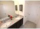 Charming bathroom featuring granite countertops, dual sinks, and decorative wall art at 3882 Resting Robin Ave, Bartow, FL 33830