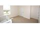 Bedroom featuring neutral carpet, a window and a white crib at 3882 Resting Robin Ave, Bartow, FL 33830