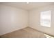 Bright bedroom featuring neutral carpet, and a window letting in natural light at 3882 Resting Robin Ave, Bartow, FL 33830