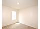 Carpeted bedroom featuring neutral walls and a window at 3882 Resting Robin Ave, Bartow, FL 33830