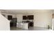 Open kitchen with stainless steel appliances, a breakfast bar, and modern pendant lighting at 3882 Resting Robin Ave, Bartow, FL 33830