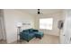 View of living room with modern couch, carpet, window and ceiling fan at 3882 Resting Robin Ave, Bartow, FL 33830