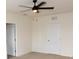 Bright bedroom with a ceiling fan and a view of an en-suite bath at 3882 Resting Robin Ave, Bartow, FL 33830