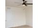 Bright bedroom with a ceiling fan and access to the hallway at 3882 Resting Robin Ave, Bartow, FL 33830