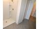 Clean and modern tiled shower with built-in shelving in neutral bathroom at 3882 Resting Robin Ave, Bartow, FL 33830