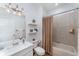 Inviting bathroom with bathtub, modern fixtures, white shelves, and a stylish mirror at 3923 Serenade Ln # 426, Lakeland, FL 33811
