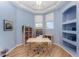 Calming blue bedroom with built-in shelving and tray ceilings at 3923 Serenade Ln # 426, Lakeland, FL 33811