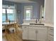 Modern kitchen with stainless steel sink, white cabinets and a cozy breakfast table at 3923 Serenade Ln # 426, Lakeland, FL 33811