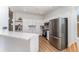 Bright kitchen with stainless steel appliances, white cabinetry and light wood flooring at 3923 Serenade Ln # 426, Lakeland, FL 33811