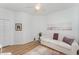 Relaxing living room with a white couch, wood floors, and ample closet space at 3923 Serenade Ln # 426, Lakeland, FL 33811
