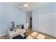 Sunny office space with natural light, wooden floors, a comfortable chair, and closet at 3923 Serenade Ln # 426, Lakeland, FL 33811