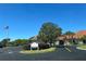 The Town Center, featuring an American flag and mature trees, set against a clear blue sky at 3923 Serenade Ln # 426, Lakeland, FL 33811