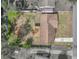 Aerial view showing house, patio, backyard, and surrounding property lines at 407 Ne 8Th St, Mulberry, FL 33860