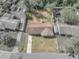 Aerial view of a home showcasing the property lines and surrounding neighborhood at 407 Ne 8Th St, Mulberry, FL 33860