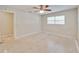 Bedroom featuring a ceiling fan and natural light from the large windows at 407 Ne 8Th St, Mulberry, FL 33860