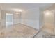 A classic dining room showcases wainscotting, tile floors, and an open view to the other room at 407 Ne 8Th St, Mulberry, FL 33860