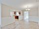 Dining room with views into the kitchen, and views to the backyard at 407 Ne 8Th St, Mulberry, FL 33860