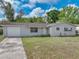 Charming single-story house with well-maintained front yard and attached garage at 407 Ne 8Th St, Mulberry, FL 33860
