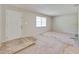 Spacious living room with a front door, a window, and flooring in need of replacing at 407 Ne 8Th St, Mulberry, FL 33860