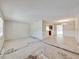 Open-concept living and dining room featuring flooring in need of replacing at 407 Ne 8Th St, Mulberry, FL 33860