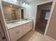 Bathroom with double sink vanity, granite countertop, ceramic tile flooring, and tiled shower at 4189 Radford Rd, Bartow, FL 33830