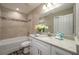 Well-lit bathroom featuring granite counters and shower-tub combo at 4189 Radford Rd, Bartow, FL 33830