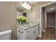 Bathroom featuring granite counters, a vanity mirror, and wood-look floors at 4189 Radford Rd, Bartow, FL 33830