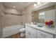 Well-lit bathroom with tile and granite vanity at 4189 Radford Rd, Bartow, FL 33830