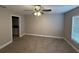 Spacious bedroom with carpet, a ceiling fan and en suite bathroom entrance at 4189 Radford Rd, Bartow, FL 33830