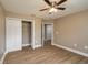 Bedroom showcasing wood-look floors, a ceiling fan, and a closet at 4189 Radford Rd, Bartow, FL 33830